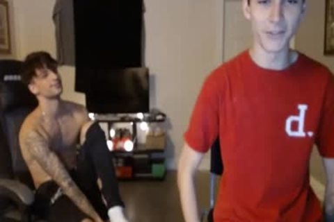 two youthful boys Caressing Their ramrods